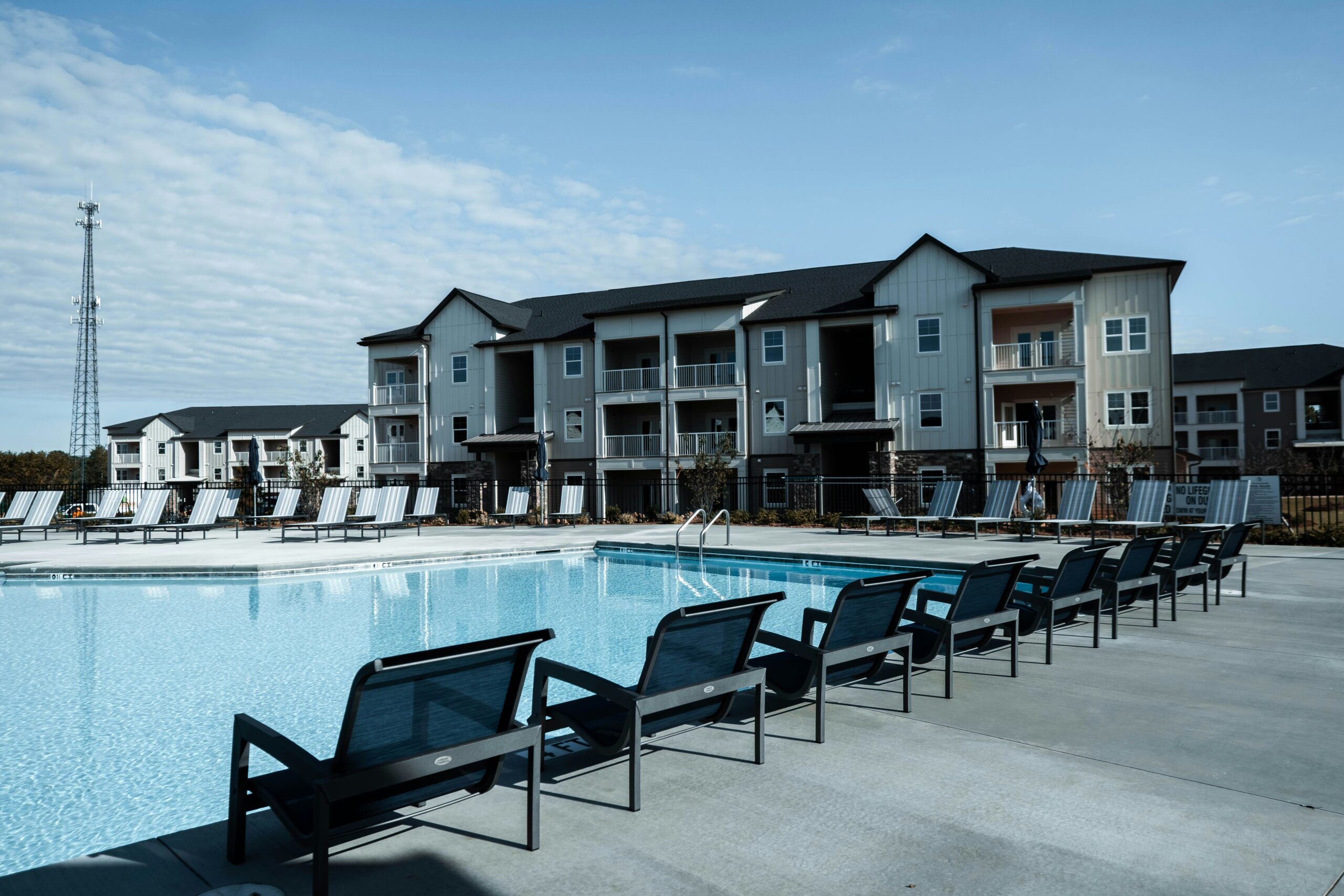 pool area in a modern apartment community before exterior cleaning and property maintenance services